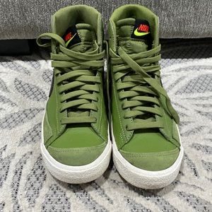 Army green and black Nike blazers